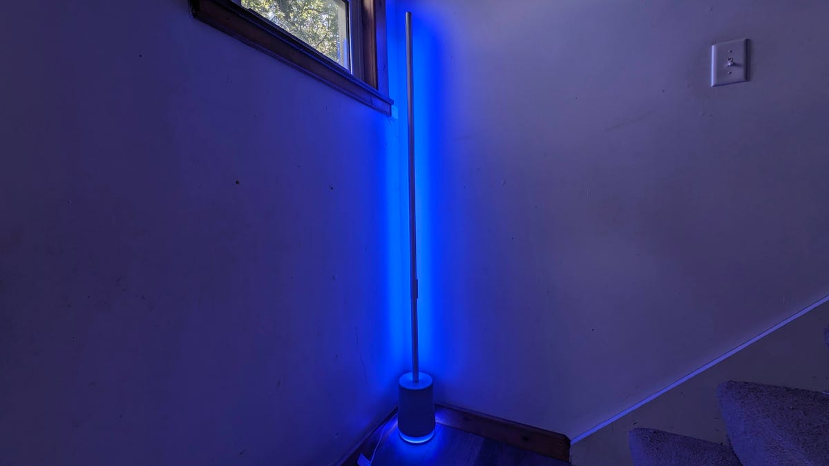 Govee Floor Lamp Pro glows blue in the corner