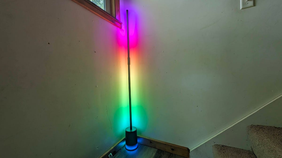 Govee 2 floor lamp showing a rainbow of colors in a corner.