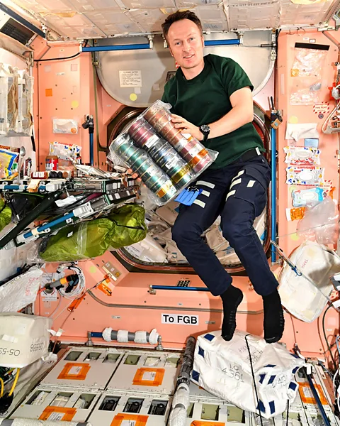 ESA/NASA ESA astronaut Matthias Maurer holds a package of space food from his home region of Saarland (Credit: ESA/NASA)