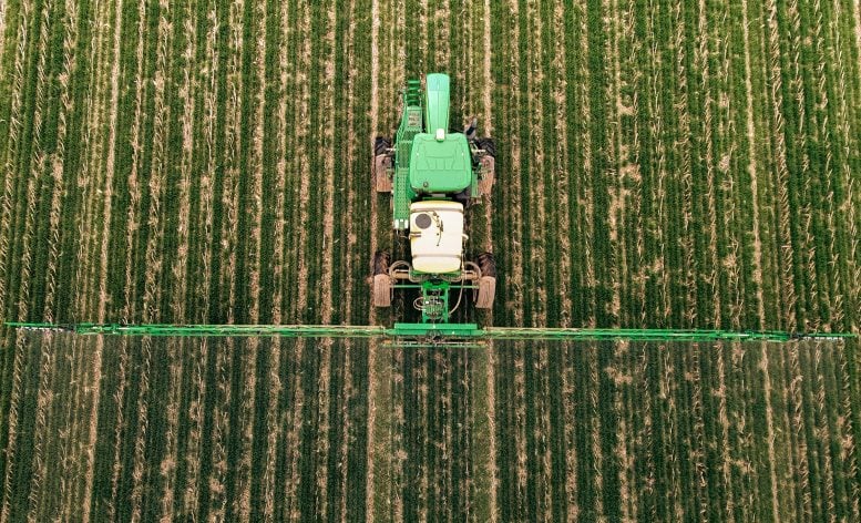 A machine sprays cover crops in a field in western Kentucky