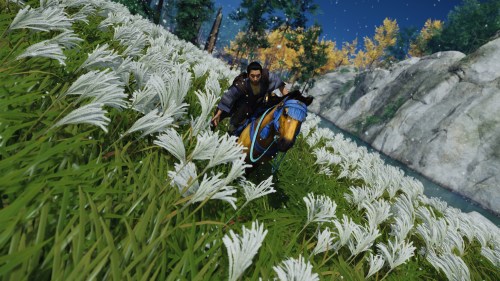 Jin rides through a field of flowers.