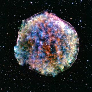 Blurry looking multi-colored orb against star-studded space background.