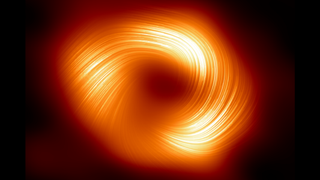 A bright orange ring with bright swirls of light in it on a dark background