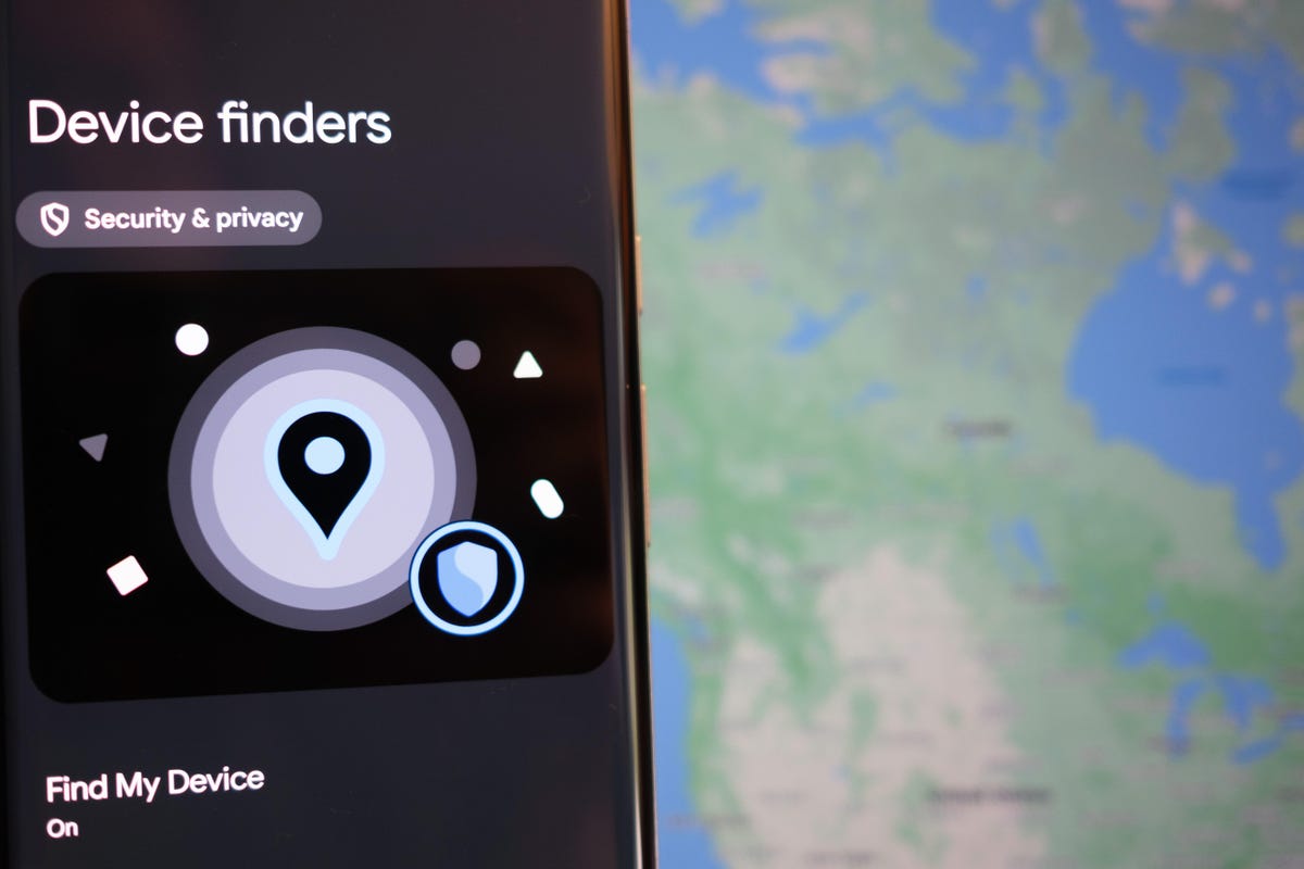 Android phone with device finder setting open.  In the background is a map from Google's Find My Device service.