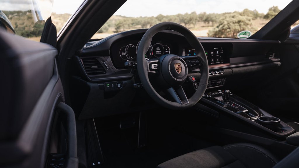 The interior of a hybrid Porsche 911 Carrera GTS.