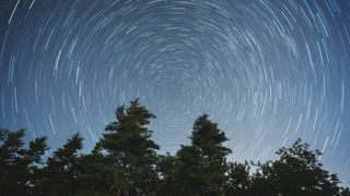 Spiral star lines in the night sky caused by the rotation of the Earth