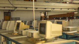 Vintage photo of a room with abandoned computers