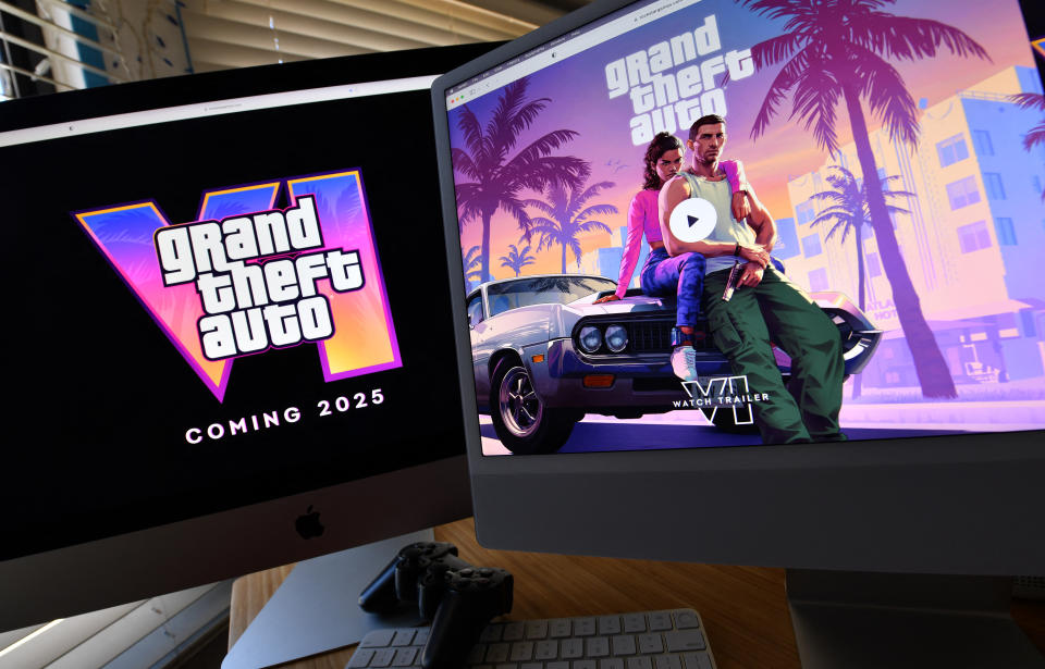 This illustration photo taken in Los Angeles, California on December 5, 2023 shows a trailer for Rockstar Games' Grand Theft Auto 6 played on computer screens.  The first trailer for 