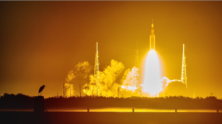 The launch of the Artemis 1 Space Launch System rocket as seen from the Kennedy Space Center press site.