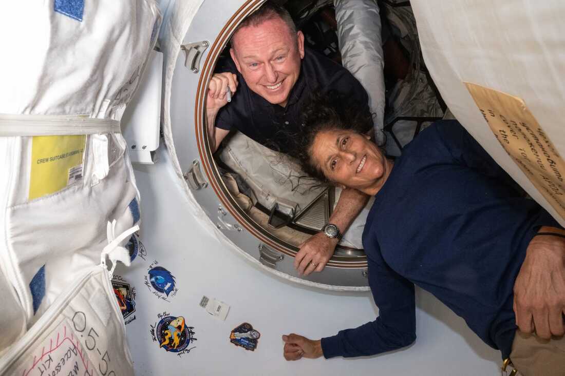 NASA's Boeing crew test astronauts (top) Butch Wilmore and Sonny Williams, as seen aboard the International Space Station.  The astronauts' return to Earth has been delayed while NASA conducts additional tests on the Starliner's thrusters.